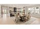 Light and bright dining area with wooden table and kitchen views at 1325 Ballard Dr, Waxhaw, NC 28173