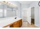 Clean bathroom with light blue walls and a vanity with wood cabinets at 136 Kristens Court Dr, Mooresville, NC 28115