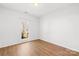 Well-lit bedroom with light wood flooring and a window at 136 Kristens Court Dr, Mooresville, NC 28115