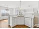 White kitchen with breakfast bar and island at 136 Kristens Court Dr, Mooresville, NC 28115