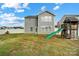 Large backyard with grassy area and playset at 1964 Clear Brooke Dr, Kannapolis, NC 28083