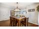 Dining area with wood table and chairs, kitchen view at 1964 Clear Brooke Dr, Kannapolis, NC 28083