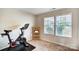 Home exercise room with Peloton bike and storage shelf at 1964 Clear Brooke Dr, Kannapolis, NC 28083