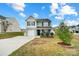 Two-story house with gray siding, white garage door, and landscaping at 1964 Clear Brooke Dr, Kannapolis, NC 28083