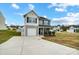 Two-story house with gray siding, white garage door, and landscaping at 1964 Clear Brooke Dr, Kannapolis, NC 28083