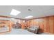 Spacious basement recreation area with a comfortable couch and dining area at 206 N Trexler Ave, Rockwell, NC 28138