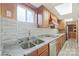 Modern basement kitchen with granite countertops and stainless steel appliances at 206 N Trexler Ave, Rockwell, NC 28138