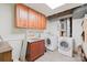 Convenient basement laundry room with washer, dryer and storage at 206 N Trexler Ave, Rockwell, NC 28138