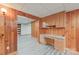 Basement office with built-in desk and ample shelving at 206 N Trexler Ave, Rockwell, NC 28138