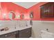 Bathroom with coral walls, marble vanity, and updated fixtures at 206 N Trexler Ave, Rockwell, NC 28138