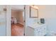 Small bathroom with light blue vanity and tiled walls at 206 N Trexler Ave, Rockwell, NC 28138