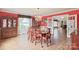 Formal dining room with hardwood floors, a chandelier, and red walls at 206 N Trexler Ave, Rockwell, NC 28138