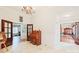 Bright entryway with hardwood floors, an antique organ, and access to other rooms at 206 N Trexler Ave, Rockwell, NC 28138