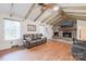 Gathering room with vaulted ceilings, a stone fireplace, and hardwood floors at 206 N Trexler Ave, Rockwell, NC 28138