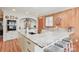 Modern kitchen with granite countertops, white cabinets, and a large island at 206 N Trexler Ave, Rockwell, NC 28138