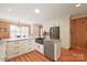 Modern kitchen with granite countertops, white cabinets, and a large island at 206 N Trexler Ave, Rockwell, NC 28138