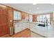 Modern kitchen with granite countertops, white cabinets, and a large island at 206 N Trexler Ave, Rockwell, NC 28138