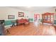 Spacious living room with hardwood floors, a red sofa, and antique furniture at 206 N Trexler Ave, Rockwell, NC 28138