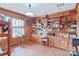 Home office with wood paneling, built-in shelves, and hardwood floors at 206 N Trexler Ave, Rockwell, NC 28138