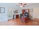 Home office with built-in wooden desk and hardwood floors at 206 N Trexler Ave, Rockwell, NC 28138