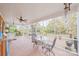 Relaxing screened porch with brick flooring and outdoor seating at 206 N Trexler Ave, Rockwell, NC 28138