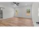 Bedroom featuring large windows, a barn door to bathroom, luxury vinyl plank flooring and ample space at 2410 Brantley Rd, Kannapolis, NC 28083