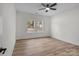 Bright bedroom with natural light, ceiling fan, and luxury vinyl plank flooring at 2410 Brantley Rd, Kannapolis, NC 28083