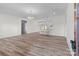 Open-concept living room showcasing natural light, luxury vinyl plank flooring, and views into the kitchen at 2410 Brantley Rd, Kannapolis, NC 28083