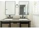 Modern bathroom with double vanity, gray countertop, and black faucets at 6372 Morehead Rd, Harrisburg, NC 28075