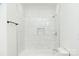 Clean bathroom with white tiled shower/tub combo at 6372 Morehead Rd, Harrisburg, NC 28075