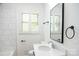 Updated bathroom with white vanity, single sink, and white tiled shower at 6372 Morehead Rd, Harrisburg, NC 28075