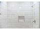 Clean bathroom with white tiled shower/tub combo at 6372 Morehead Rd, Harrisburg, NC 28075