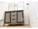 Bathroom with double vanity, gray wood cabinets, and black accents at 6372 Morehead Rd, Harrisburg, NC 28075