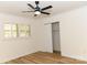 Simple bedroom with hardwood floors and a large closet at 6372 Morehead Rd, Harrisburg, NC 28075