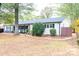 Newly renovated Ranch home with white brick exterior, black shutters, and landscaped yard at 6372 Morehead Rd, Harrisburg, NC 28075