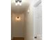 Clean hallway with light walls and wood flooring at 6372 Morehead Rd, Harrisburg, NC 28075