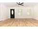 Bright living room with hardwood floors and a view of the front yard at 6372 Morehead Rd, Harrisburg, NC 28075