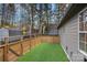 Fenced backyard with artificial turf and privacy fence, perfect for entertaining and low maintenance at 9027 Twin Trail Dr, Huntersville, NC 28078