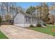 Charming one-story home with gray siding, black shutters, and a spacious driveway with lush green lawn at 9027 Twin Trail Dr, Huntersville, NC 28078