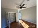 Bright bedroom with hardwood floors, a ceiling fan, and closet with shelving at 914 30Th Avenue Nw Dr # 1, Hickory, NC 28601