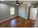 Cozy bedroom with hardwood floors, ceiling fan, and double door closet at 914 30Th Avenue Nw Dr # 1, Hickory, NC 28601