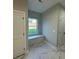 Hallway with marble tiled floor, window seat, and neutral paint color at 914 30Th Avenue Nw Dr # 1, Hickory, NC 28601