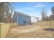 Backyard of the house with wooden fence and gravel ground at 1000 Fairground St, Charlotte, NC 28208