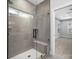 Spa-like bathroom with walk-in shower, built-in seat, and window at 1000 Fairground St, Charlotte, NC 28208