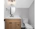 Light-toned bathroom with wood vanity, quartz countertop, and black fixtures at 1000 Fairground St, Charlotte, NC 28208