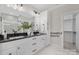 Modern bathroom with double vanity, walk-in shower, and large mirror at 1000 Fairground St, Charlotte, NC 28208