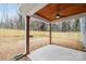 Covered patio with concrete flooring, wooden ceiling, and ceiling fan at 1000 Fairground St, Charlotte, NC 28208