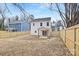 Large backyard with wooden fence and clear view of neighboring homes at 1002 Fairground St, Charlotte, NC 28208