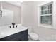 Modern bathroom with a white vanity and black matte fixtures at 1002 Fairground St, Charlotte, NC 28208