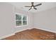 Spacious bedroom with hardwood floors and a large window at 1002 Fairground St, Charlotte, NC 28208